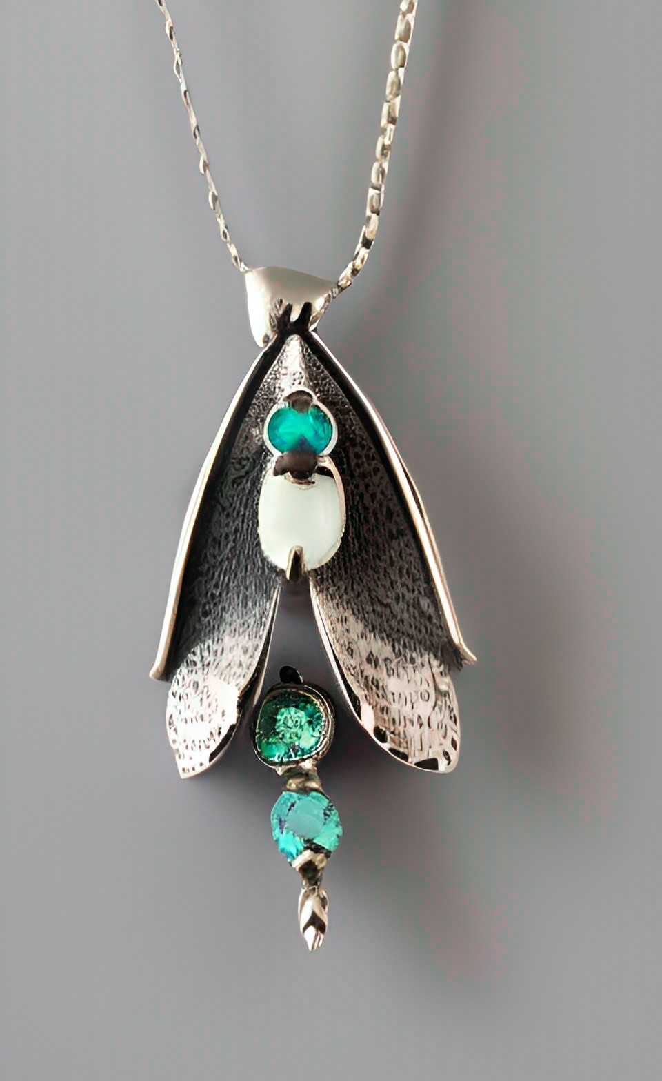 stylized moth pendant, silver, gemstones preview